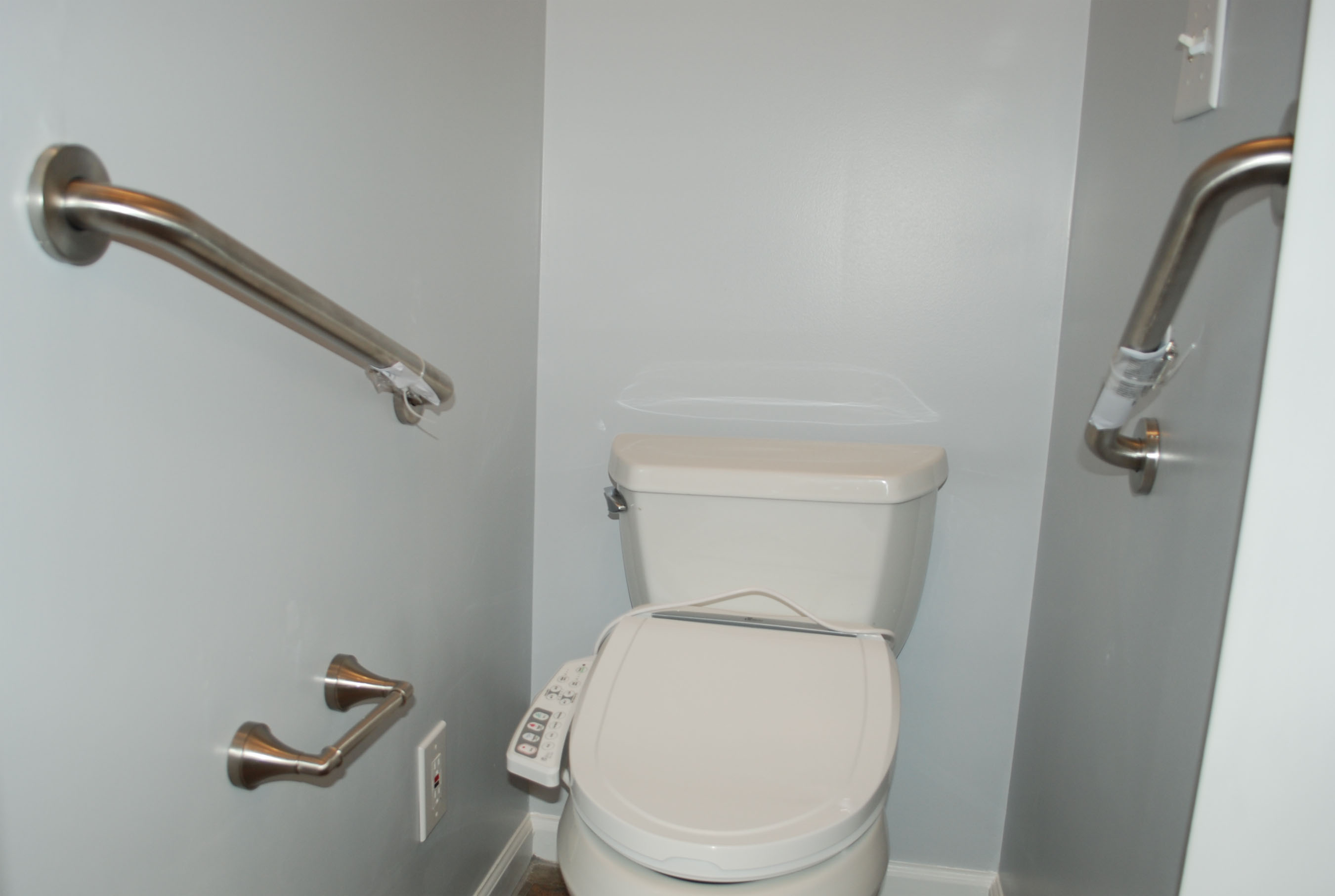bathroom toliet with guard rails